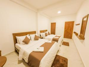 מיטה או מיטות בחדר ב-The Mount View Single Tree Hotel