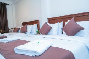 מיטה או מיטות בחדר ב-The Mount View Single Tree Hotel