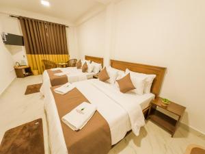מיטה או מיטות בחדר ב-The Mount View Single Tree Hotel