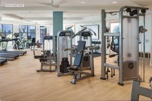 a gym with rows of treadmills and machines at Lux Playa Vista 2 BDRM Condo in Los Angeles