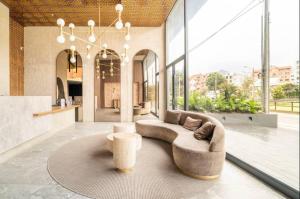 a large living room with a couch and a table at LUXURY LOFT IN AMAZING BUILDING + POOL in Bogotá
