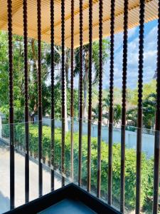 a view from the window of a building with a view of a park at Dor-Shada Resort By The Sea in Na Jomtien