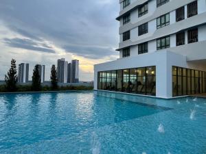 a large swimming pool in front of a building at Mie Homestay Edusphere Suite, University of Cyberjaya near Tamarind Square in Cyberjaya
