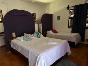 two beds in a room with two beds sidx sidx sidx sidx at Hotel Maya Luna Adults Only in Mahahual