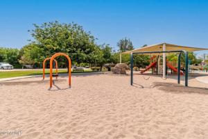 a playground in a park with a swing set at The Hudson Suite Spot - Studio Apt Close to ASU in Tempe