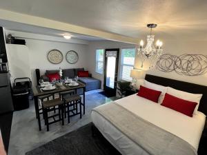 a bedroom with a bed and a dining room at The Hudson Suite Spot - Studio Apt Close to ASU in Tempe