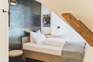 a bedroom with a bed and a shower at HOTEL BLAUE ROSE -digital check in- in Feldkirch