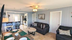 a living room with a couch and a table at 213 Ohio in Fort Myers Beach