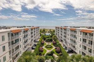 an aerial view of two apartment buildings with a park at Beach Club # 133 - St Simons Island in Saint Simons Island