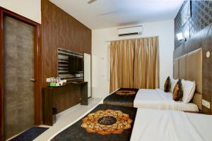 Postel nebo postele na pokoji v ubytování Hotel HSP Suites At Delhi Airport