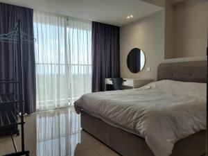 a bedroom with a bed and a large window at Venus Cozy Home in Seri Manjung +19 photos