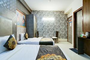 Tempat tidur dalam kamar di Hotel HSP Suites At Delhi Airport