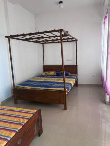 a bedroom with two bunk beds in a room at Beach Paradise in Matara