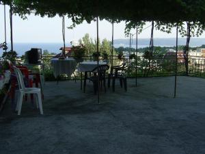 a table and chairs sitting on a patio at Стаи за гости ЖАНА in Varna City