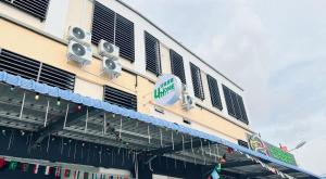 a building with speakers on the side of it at UniHome Suite in Bintulu