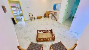 an overhead view of a room with chairs and tables at 26 LaPorte in Pondicherry