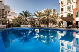 Bazén v ubytování Muscat Oasis Residences nebo v jeho okolí