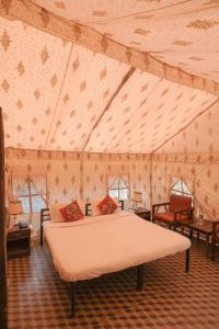 Ένα ή περισσότερα κρεβάτια σε δωμάτιο στο Jungle Book Ranthambore