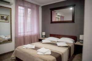 Postel nebo postele na pokoji v ubytování Carnival City Hotel Oradea