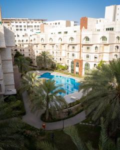 Bazén v ubytování Muscat Oasis Residences nebo v jeho okolí