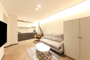 a living room with a couch and a table at HOUND HOTEL sasang branch in Busan