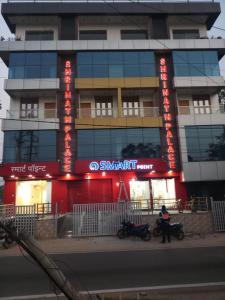 a building with a sign on the side of it at Shrinath Palace in Deoghar