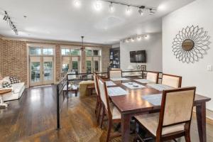 a dining room and living room with a table and chairs at A Village Overlook in Saint Simons Island