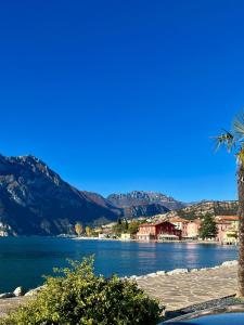 a view of a lake with mountains in the background at Appartamento Marocche in Nago-Torbole