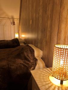 Postel nebo postele na pokoji v ubytování Gîte Rubis - JACUZZI - Pairi Daiza - 6 pers