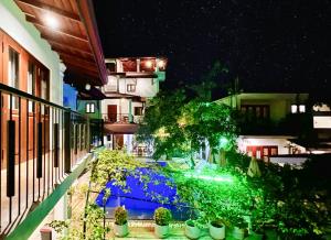 a view of a street at night with plants at Villa Red Lobster in Hikkaduwa