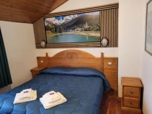Postel nebo postele na pokoji v ubytování Albergo Meuble Tarandan