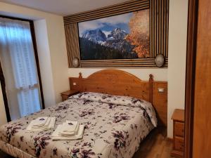 Postel nebo postele na pokoji v ubytování Albergo Meuble Tarandan