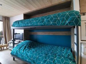 Ein Bett oder Betten in einem Zimmer der Unterkunft L'échappée étoilée - Métabief
