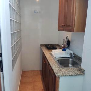 a kitchen with a sink and a counter top at Hostal Albergue Garafía El Tablado in Tablado de la Montañeta