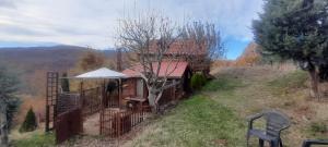 a small house on a hill with a fence at Krushka, Kochani, Osogovo in Kočani