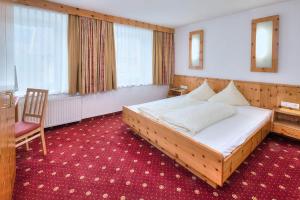 Łóżko lub łóżka w pokoju w obiekcie Kinderhotel Stefan