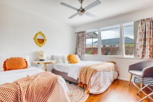a bedroom with two beds and a window at Sweet Home between CBD and University in Hamilton