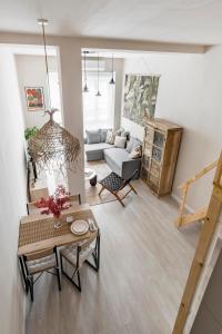 a living room with a couch and a table at Charming apartment central Madrid in Madrid