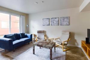 a living room with a blue couch and two chairs at San Jose 3br w pool spa patio parking SFO-1537 in San Jose