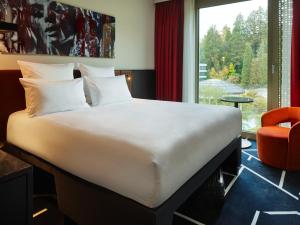 Postel nebo postele na pokoji v ubytování TRIBE Baden-Baden + 37 fotografií