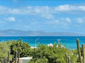 a view of the ocean from a house at La Ventana Apartments Torote #5 in La Ventana +7 photos