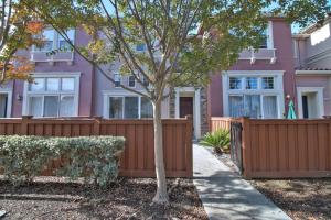 a pink house with a fence and a tree at San Jose 3br w pool spa patio parking SFO-1537 in San Jose