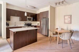an open kitchen and dining room with a table and chairs at Dublin 2br w pool ac nr shopping groceries SFO-1482 in Dublin