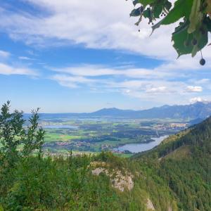 a view of a valley from a mountain with a lake at Alpenhimmel in Nesselwang