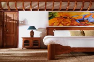 Postel nebo postele na pokoji v ubytování BluSalzz Villa - Muhamma, Alleppey - Kerala