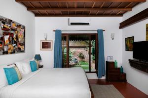 Postel nebo postele na pokoji v ubytování BluSalzz Villa - Muhamma, Alleppey - Kerala