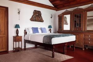 Postel nebo postele na pokoji v ubytování BluSalzz Villa - Muhamma, Alleppey - Kerala