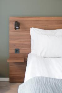 Postel nebo postele na pokoji v ubytování Quality Hotel Grand Kristianstad