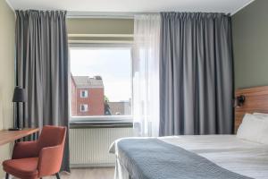 Postel nebo postele na pokoji v ubytování Quality Hotel Grand Kristianstad