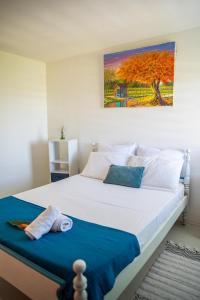 Un pat sau paturi într-o cameră la Duplex à 1 minute de la plage